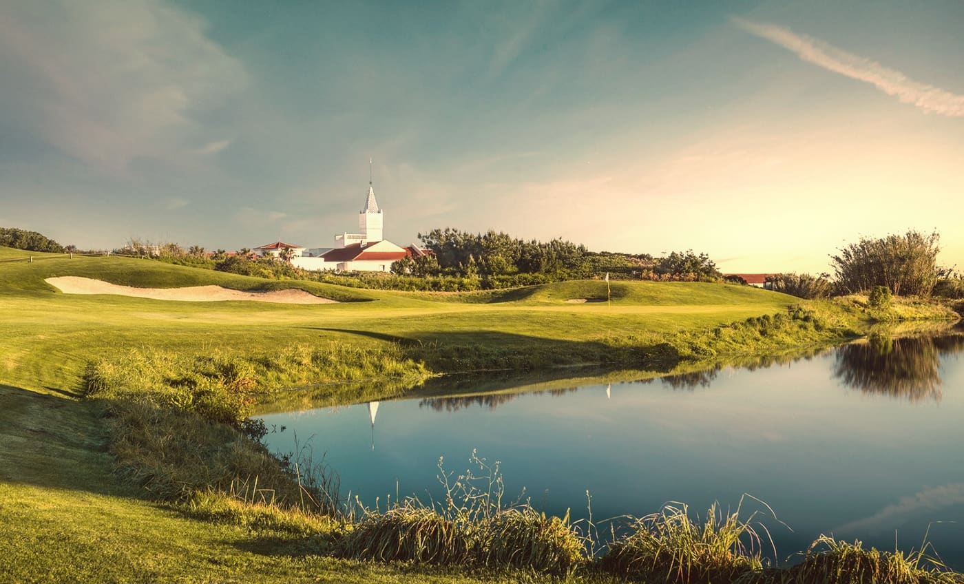 Golf course with pond at golden hour